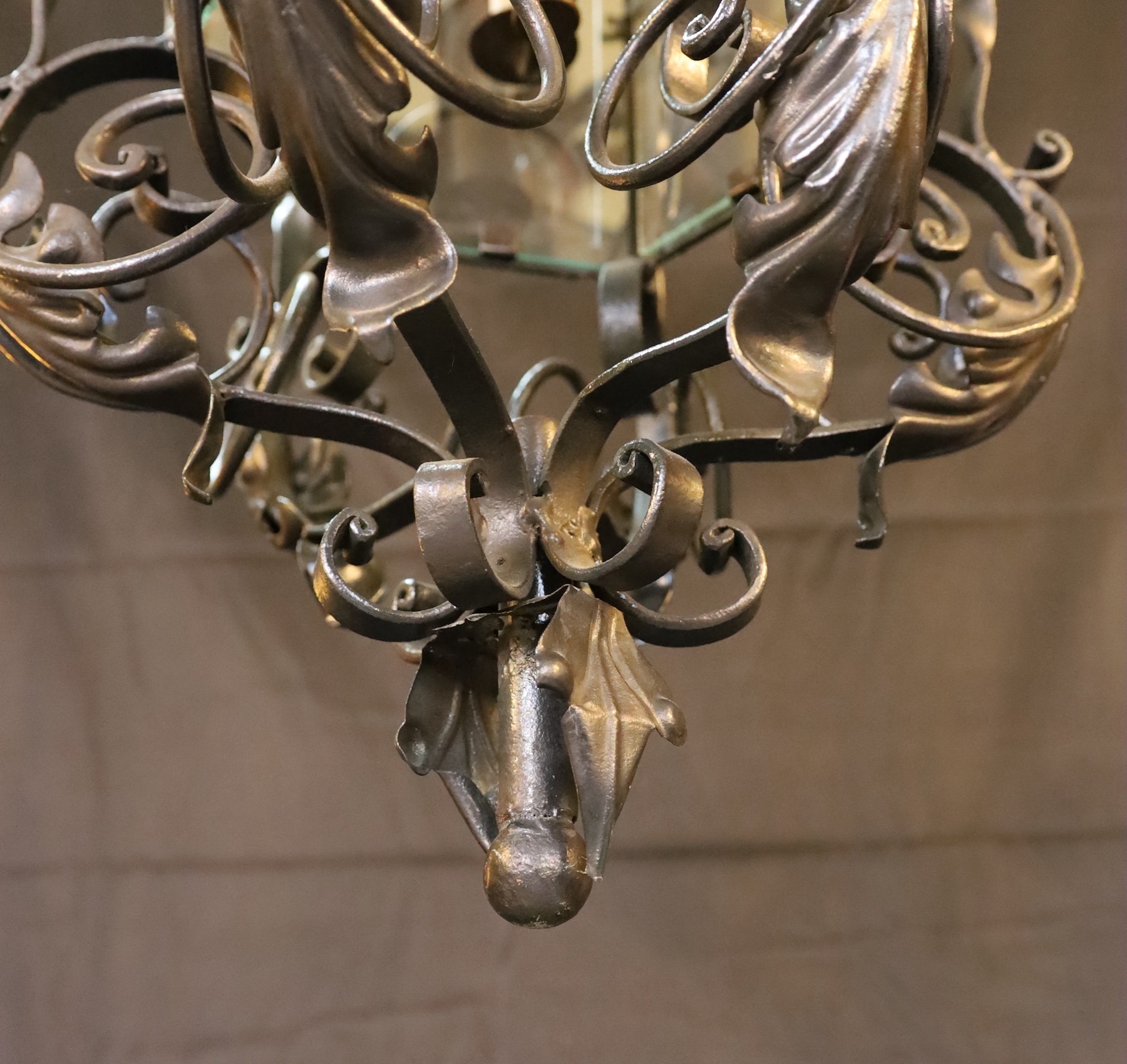 An early 20th century English black painted wrought iron hexagonal hall lantern, drop 92cm. width 42cm